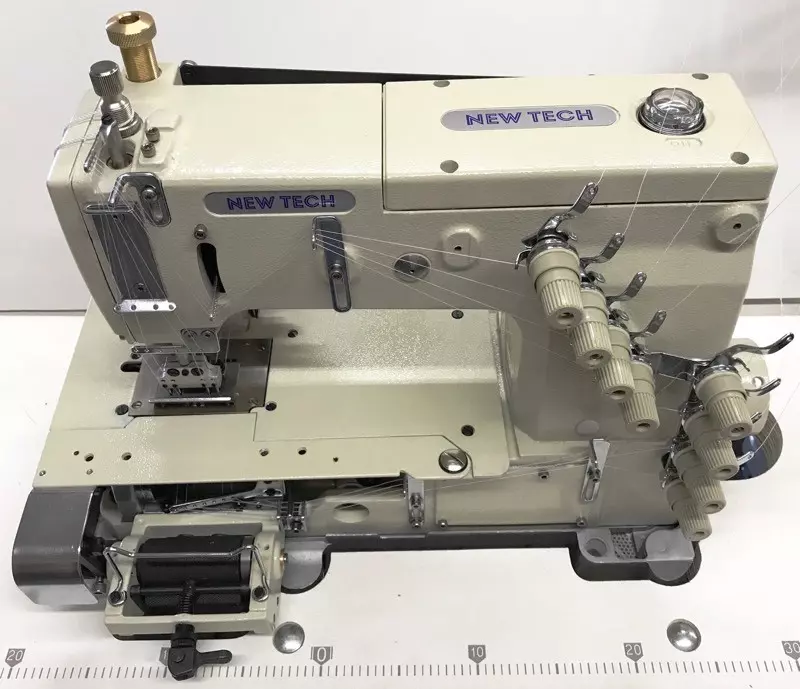 New-Tech 1404-PMD 4 Needle Flatbed Double Chain Stitch Industrial Sewing Machine With Table and Servo Motor New-Tech 1404-PMD 4 Needle Flatbed Double Chain Stitch Industrial Sewing Machine With Table and Servo Motor