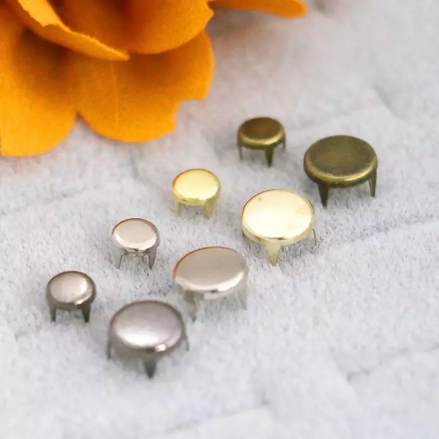 Premium Photo  Rivets, fabric on a white table